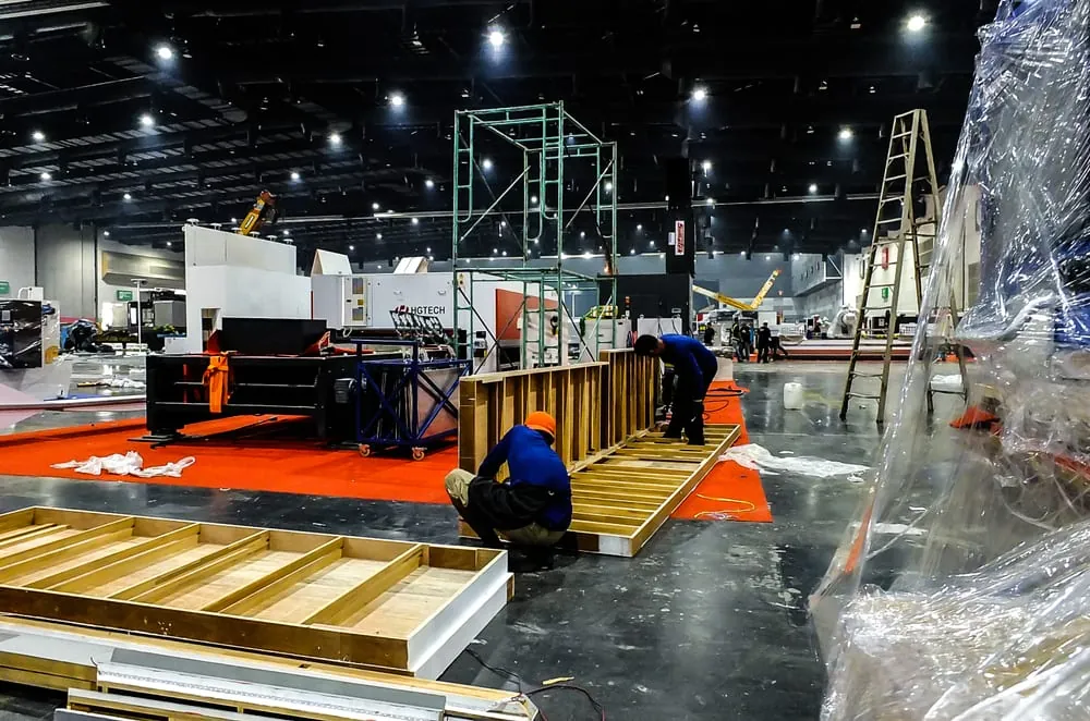 Stage and rigging build in progress ahead of an event