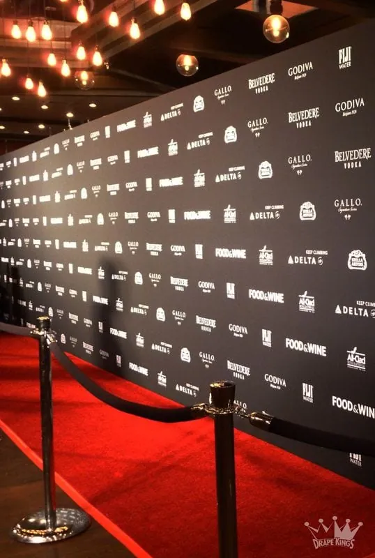 Red carpet step-and-repeat backdrop printed for a launch event